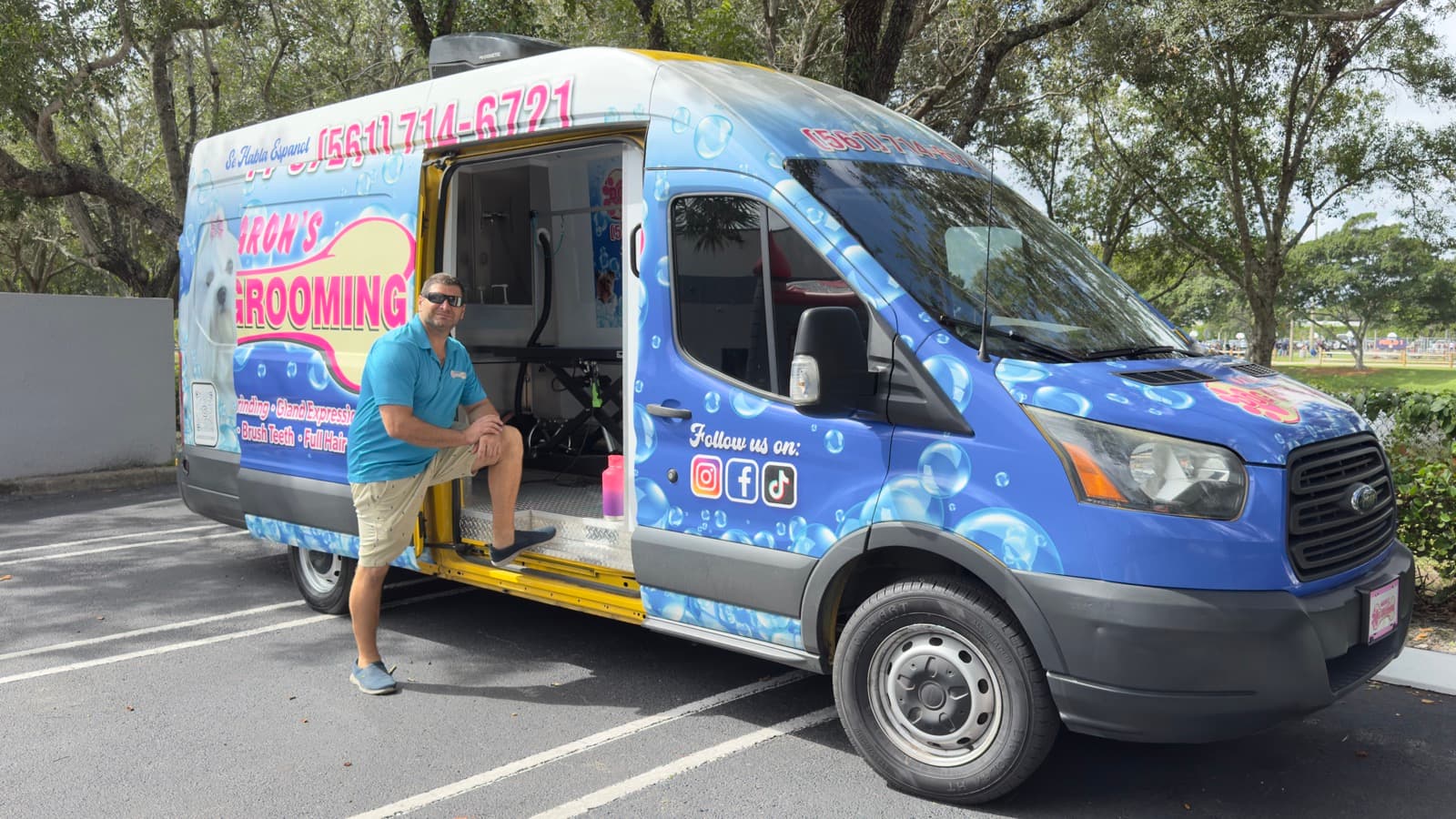 Aaron with van door open ready to groom